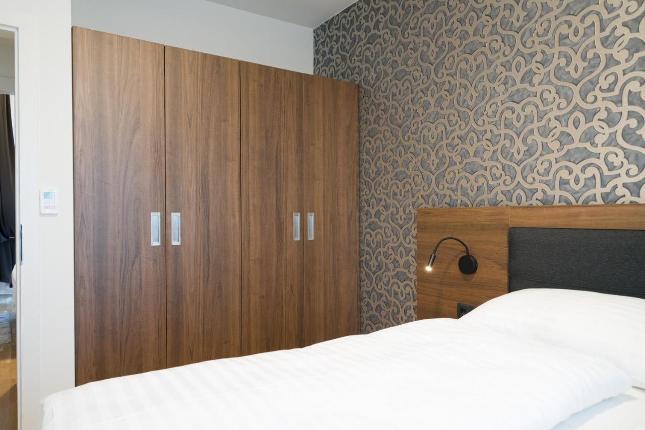 Myapartments Vienna Exterior photo A bedroom with a wardrobe
